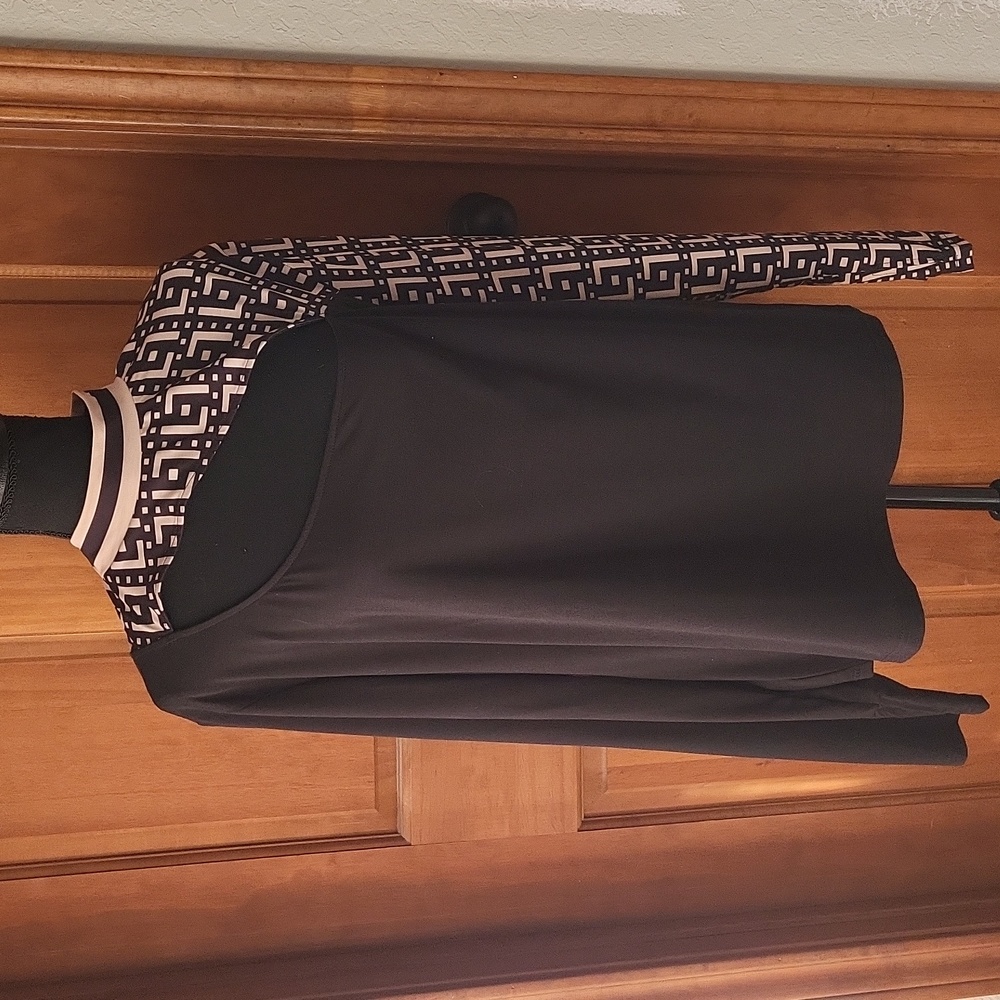 Black long sleeve top with cream and black design down one side of sleeve